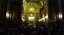 People visiting the mummified corpse of the Queen Saint in Coimbra Portugal