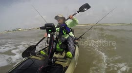 Kayak flips in the surf