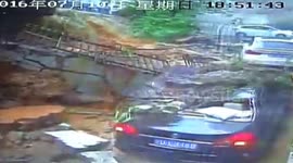 Collapsed wall smashes cars in underground garage