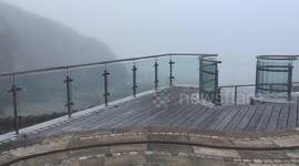 Eerie fog rolls in over Portreath Beach Cornwall after heatwave