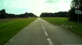 Car driver mistakes cycle path for road