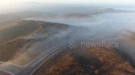 Beautiful drone footage of fog rolling through California hills