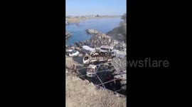 Syria: A huge crowd of civilians at one of the river crossings in the city of Deir ez-Zor, wanting to cross to the opposite bank