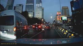 Child topples from the back of motorcycle in rush hour traffic