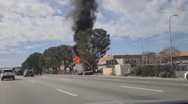 US, Los Angeles: Victorville Semi Crashes Off Freeway Into Sheriffs Station Parking Lot And Catches Fire Part 2