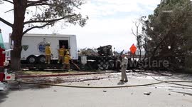 US, Los Angeles: Victorville Semi Crashes Off Freeway Into Sheriffs Station Parking Lot and Catches Fire