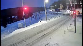 Freight train narrowly misses bus at railway crossing in Yantal, Russia