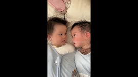 Sibling harmony: Chinese twins' first laugh captures hearts