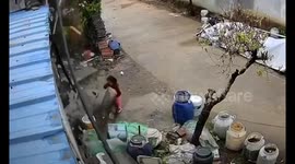 Child narrowly escapes falling concrete in Beijing, China