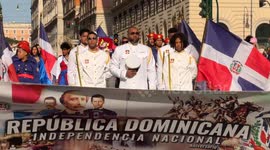 Some people originally from the Dominican Republic coming from various Italian cities participate in the procession to celebrate independence from the Government of Haiti and celebrate Carnival in Rome.