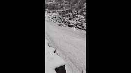 Ice flows surge down hillside as snow thaws in northern India