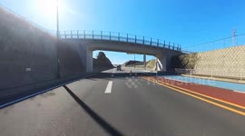 Loose plastic bag floats into motorcycle rider's helmet blocking view