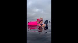 Swimming and singing in Loch Lomond. It's a cold Loch