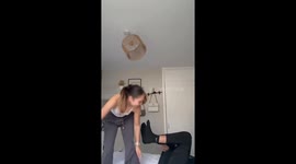 Girlfriend's teasing plan backfires as she flies across the room