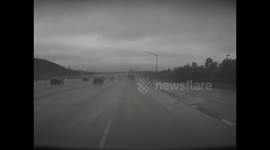 Allegedly Speeding Car Loses Control in Heavy Rain
