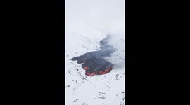 Lava flows through snow as Mount Etna continues to erupt