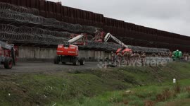 Trump's border wall strengthened as fist-pumping President soars in polls