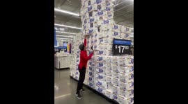 Man plays Jenga with a toilet paper tower in Los Angeles, USA