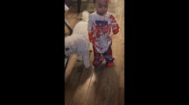 Toddler twins get covered in red paint in Houston, Texas, USA