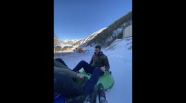 Floater ride goes wrong on snowy slope in Chechnya, Russia