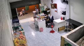 Tabby cat tumbles while trying to jump between tables