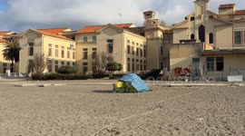 A homeless person's tent set up on the beach at Lido di Ostia in Rome.