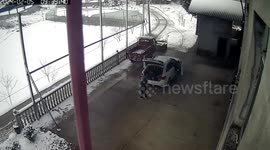 Quick-thinking driver makes a fast escape as roof collapses under weight of snow