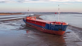 Large cargo ship runs aground in estuary near Hull