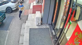 Boy slips and falls while trying to open a door in Jilin, China