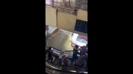 Floods surge through shopping mall during heavy rain in Indonesia