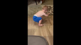 Little boy learns to say 'alligator' after receiving toy and alligator-themed shirt