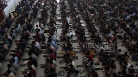 Indonesian students perform prayers during Ramadan
