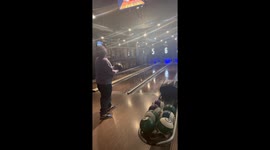Player Throws Bowling Ball Across Lanes
