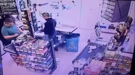 Supermarket worker jumps out of car's way as it smashes into store and customer