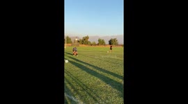 Boy trips over dog while playing football in Quilicura, Santiago, Chile