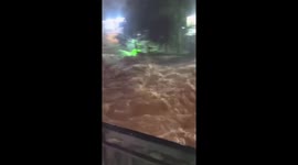 Flash flood surges into village in Indonesia