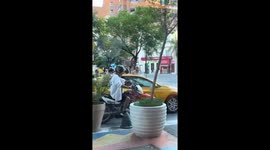 Dog rides on motorcycle wearing helmet in Santiago del Estero, Argentina