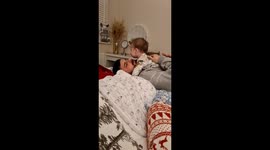 Child nearly pukes on father but he dodges just in time in Barrow-in-Furness, England, UK