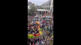 Crowds celebrate Mardi Gras parade despite weather threat in New Orleans, USA
