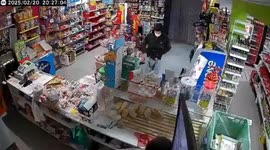 Brave shopkeeper uses ticketing gun to chase away armed robber
