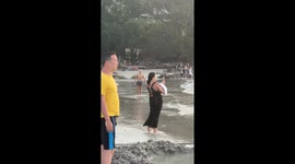 Beach Acrobatics Versus Bottle Balance