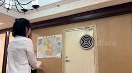 Darts miss the target and hit the door in Jiangsu, China