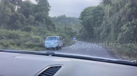 Bus rolls uncontrollably down steep road before plunging down hillside
