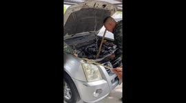 Soldiers remove huge snake from pickup truck engine