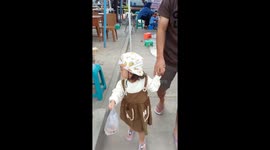 Toddler Carefully Moves Fish Around A Pole