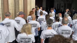 Climate activists Amy Pritchard reads a statement outside the Royal Courts of Justice
