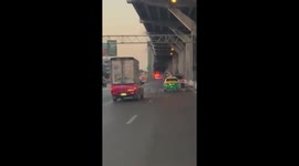 Car fire blocks lane of motorway in Bangkok, Thailand