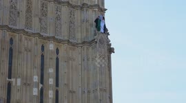 London, UK. 8 March 2025. Pro Palestine man climb on the Big Ben tower by Parliament.