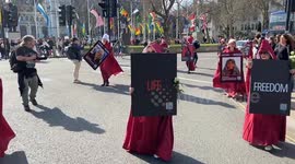 Protesters wearing The Handmaid's Tale costumes march through Central London for Women’s Day