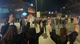 Fiery Clashes and Unrest in Greece - Greek Youth Face Riot Police, Hands Raised in a Plea Against Violence